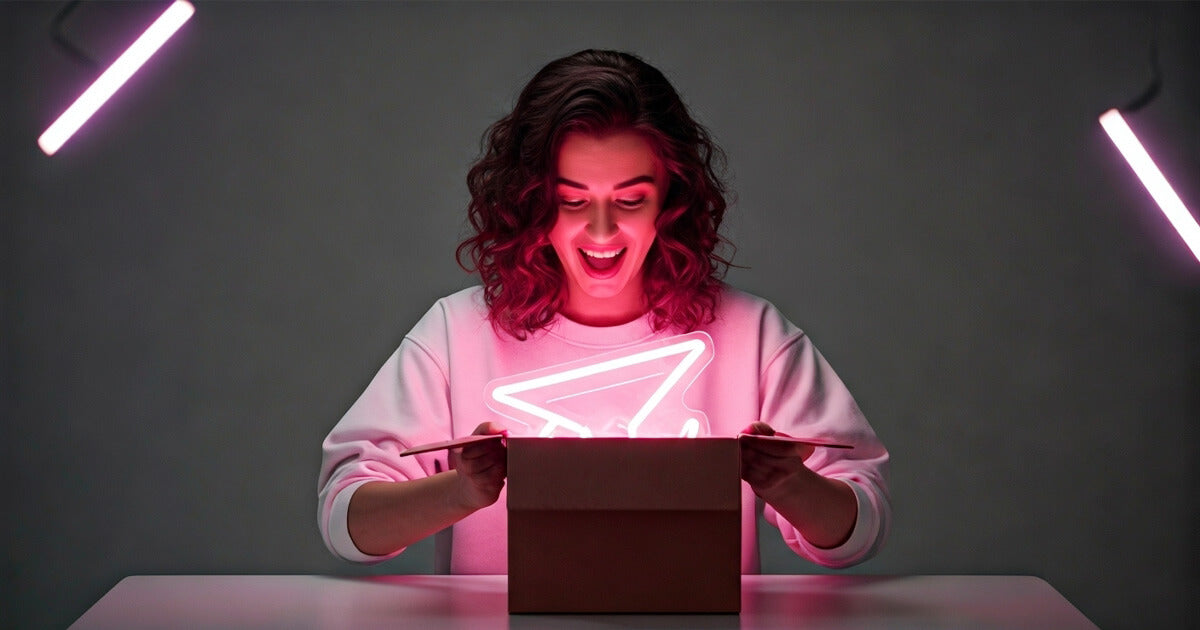 a lady opening a neon sign package