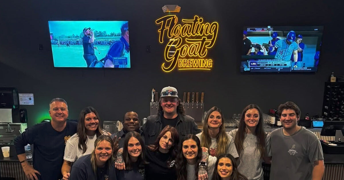 a group of people with neon sign on the background