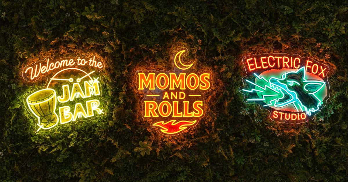 Three neon signs on a dark background, each with different text and graphics.